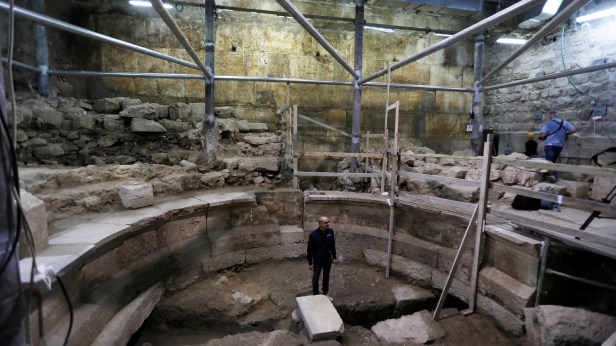 Israel Antiquities Authority archaeologist Dr. Joe Uziel stands inside a theatre-like structure during a media tour to reveal the structure which was discovered during excavation works underneath Wilson's Arch in Jerusalem's Old City